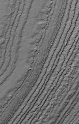 This image from NASA's Mars Global Surveyor shows layered material exposed on a slope in the south polar region of Mars. The composition of the layers, and whether they contain ice, is not known.