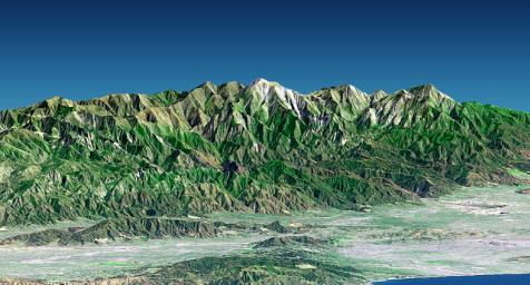 Mount San Antonio (also known as Mount Baldy) crowns the San Gabriel Mountains northeast of Los Angeles, CA in this computer-generated perspective viewed from NASA's Shuttle Radar Topography Mission from above the Malibu coastline.
