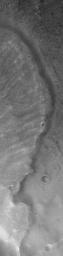 NASA's Mars Global Surveyor shows the east margin of a landslide off the southern rim of Mutch Crater in the Xanthe Terra region of Mars. This particular landslide was likely triggered by a meteor impact that occurred nearby.
