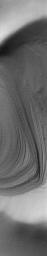 NASA's Mars Global Surveyor shows eroded, exposed layered materials in the south polar region of Mars.