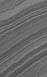 NASA's Mars Global Surveyor shows layers exposed by erosion on a slope in the martian south polar region. Both polar caps on Mars are underlain by a complex stratigraphy of layered material.
