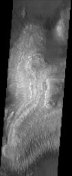 These layered deposits are located on the floor of a large canyon called Ganges Chasma which is a part of the Valles Marineris in this image captured by NASA's 2001 Mars Odyssey spacecraft.