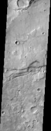 This image from NASA's Mars Odyssey spacecraft shows the cratered highlands of Terra Sirenum in Mars' southern hemisphere. Near the center of the image running from left to right one can see long parallel to semi-parallel troughs called graben.