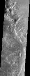 This NASA Mars Odyssey image shows the intersection of Holden Crater with Uzboi Valles. This region of Mars contains a number of features that could be related to liquid water on the surface in the Martian past.