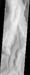 This image from NASA's Mars Odyssey shows Noctis Labyrinthus, a large valley system at the western end of the Valles Marineris canyon system notable for a pattern of intersecting valleys, which give it a maze-like appearance when viewed from above.