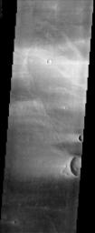 This image from NASA's Mars Odyssey spacecraft is from the region of Syrtis Major, which is dominated by a low-relief shield volcano and believed to be an area of vigorous aeolian activity with strong winds in the east-west direction.