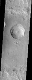 Many places on Mars, such as in this image from NASA's Mars Odyssey spacecraft of a crater superposed on the floor of a larger crater, display scabby, eroded landscapes that commonly are referred to as etched terrain.