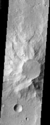 This positive relief feature in the ancient highlands of Mars, imaged by NASA's Mars Odyssey spacecraft, appears to be a heavily eroded volcanic center. The top of the feature appears to be under attack by the erosive forces of the Martian wind.