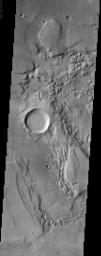 The jumbled, chaotic terrain in this NASA Mars Odyssey image may represent a source region for the Reull Vallis, one of the larger channel systems in the southern hemisphere of Mars.