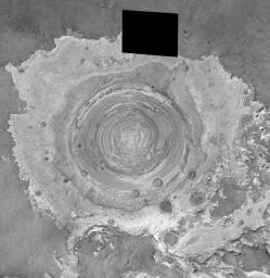 This image from NASA's Mars Global Surveyor shows a circular feature in northern Terra Meridiani on Mars.