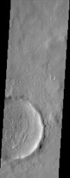 The layering of material observed at the bottom of this impact crater imaged by NASA's Mars Odyssey spacecraft suggests multiple depositional and erosional episodes in a changing environment.