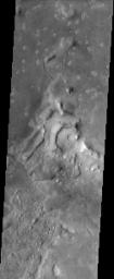 Much of the northern lowlands of Mars are thought to be relatively young volcanic flows with varying amounts of windblown dust cover. The lack of impact craters in this image from NASA's Mars Odyssey spacecraft indicate the young age of the surface.