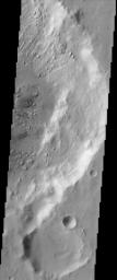 This image from NASA's Mars Odyssey covers a region in western Arabia Terra, which contains two interesting craters. The eastern floor of the largest crater seen in most of this image is bumpy and ridged in places and relatively smooth in regions.
