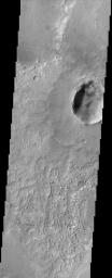 This image from NASA's Mars Odyssey is located near the equator and the prime meridian of Mars in a region called Terra Meridiani. This is a unique area of Mars that displays layers of material that appear to be in the process of being stripped away.