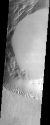 This image from NASA's Mars Odyssey shows part of the summit caldera of Pavonis Mons, the middle of three Tharsis volcanos that form a line southeast of Olympus Mons and northwest of Vallis Marineris.