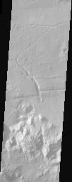 Ripple bedforms fill large fractures near the southern rim of Holden Crater in this image from NASA's Mars Odyssey spacecraft.