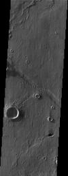 At first glance, this NASA Mars Odyssey image showing impact craters and linear ridges and troughs is typical of the southern highlands. However, upon closer examination migrating sand dunes are observed within the troughs.