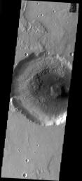 This image from NASA's Mars Odyssey shows a crater interior on Mars filled by a thick accumulation of material. The fill is now undergoing removal, exposing the floor beneath the material.