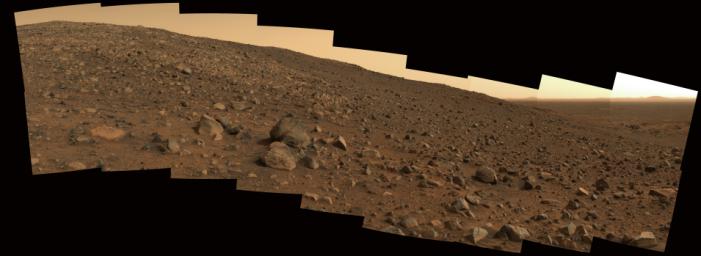 On June 19, 2005, NASA's Spirit rover took this true-color panorama nicknamed 'Sunset Ridge' showing the terrain that lay ahead of the rover.
