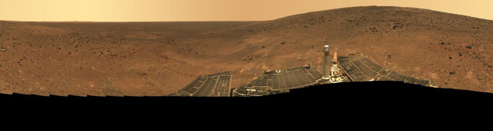 The rocky outcrops downhill and on the left side of this mosaic include 'Larry's Lookout' and 'Cumberland Ridge,' which NASA's Spirit rover explored in April, May, and June of 2005.