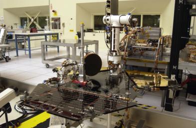 NASA's Rover 2 equipment deck, with solar arrays partially deployed, in NASA's JPL's Spacecraft Assembly Facility's cleanroom.