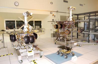 The twin rovers of NASA'a Mars Exploration Rover Mission pose with their groundbreaking predecessor, the flight spare of the Sojourner rover from NASA's 1997 Pathfinder mission.
