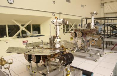 The twin rovers sit side-by-side in different stages of deployment. NASA's Rover 2's (left) front wheels are stowed, while NASA's Rover 1's front wheels are deployed.