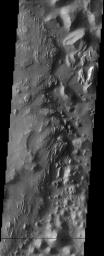 This image from NASA's Mars Odyssey spacecraft shows the easternmost end of Valles Marineris, where a rugged, jumbled terrain known as chaos displays a stratigraphy that could be described as precarious.
