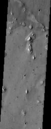 This is an image from NASA's Mars Odyssey spacecraft of an area within Acidalia Planitia that contains patterned ground (near the top of the image). This type of surface is likely related to subsurface ice.