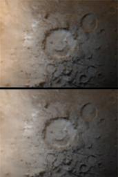 NASA's Mars Global Surveyor shows Galle Crater on Mars, informally known as 'Happy Face,' as it appeared in early southern winter.