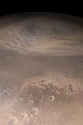 NASA's Mars Global Surveyor shows an eastward-moving dust storm on the plains north of Cydonia and western Arabia Terra on Mars.