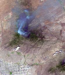 On June 26, NASA's Terra satellite acquired this image of the Aspen fire burning out of control north of Tucson, AZ.