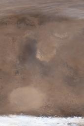 NASA's Mars Global Surveyor shows a large dust storm engulfing southern Isidis Planitia on Mars.