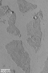 The Marte Vallis system of Mars, located east of Cerberus and west of Amazonis Planitia, is known for its array of broken, platy flow features as seen by NASA's Mars Global Surveyor.