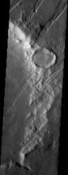 NASA's Mars Odyssey spacecraft captured this image in August 2003, showing large grooves indicating tectonic faulting cross just south of the Tharsis Monteson Mars.