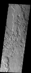 This image shows an example of the terrain that is present at the boundary between the southern highlands and the northern lowlands of Elysium Planitia. This image was captured by NASA's Mars Odyssey spacecraft in November 2003.