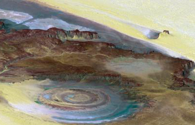 This prominent circular feature, known as the Richat Structure, in the Sahara desert of Mauritania is often noted by astronauts because it forms a conspicuous bull's-eye on the otherwise rather featureless expanse of the desert.