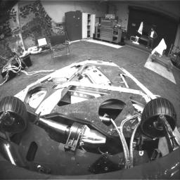 This image, taken in the JPL In-Situ Instruments Laboratory or 'Testbed,' shows the view from the front hazard avoidance cameras on the Mars Exploration Rover Spirit after the rover has backed up and turned 45 degrees counterclockwise.