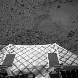 This image shows the view from NASA's Mars Exploration Rover Spirit after it successfully completed a 115 degree turn to face northwest, the direction it will roll off the lander. 