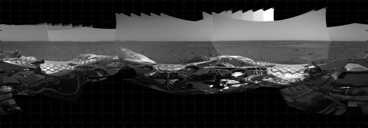 This 360-degree panoramic mosaic image composed of data from the hazard avoidance camera onboard NASA's Mars Exploration Rover Spirit shows a view of the lander from under the rover deck.