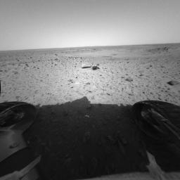  In the foreground of this image from NASA's Mars Exploration Rover Spirit are two rocks dubbed 'Sashimi' and 'Sushi.'