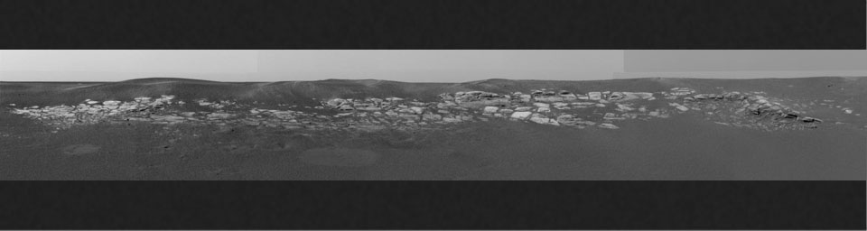 This sweeping look at the unusual rock outcropping near NASA's Mars Exploration Rover Opportunity. 3D glasses are necessary to view this image.