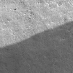 NASA's Mars Exploration Rover Spirit close-up look at the martian rock dubbed Adirondack. The rock's smooth and pitted surface is revealed in this first-ever microscopic image of a rock on another planet.