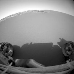 This image taken at Meridiani Planum on Jan 31, 2004, confirmed that NASA's Mars Exploration Rover Opportunity's six wheels rolled off the lander and onto martian soil and shows its view of the martian horizon.