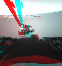 This is a three-dimensional stereo anaglyph of an image taken by the front hazard-identification camera onboard NASA's Mars Exploration Rover Opportunity, showing the rover's arm in its extended position. 3D glasses are necessary to view this image.