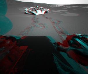 This 3-D view from behind NASA's Mars Exploration Rover Opportunity shows the path the rover has traveled since rolling 1 meter (3 feet) away from its empty lander on the seventh martian day, or sol, of its mission. 3D glasses are necessary.