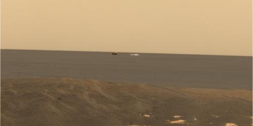 From its location at the inner edge of the small crater surrounding it, NASA's Mars Exploration Rover Opportunity was able to look out to the plains where its backshell and parachute landed.