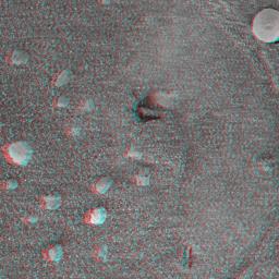 This 3-D anaglyph, from NASA's Mars Exploration Rover Spirit, shows a circular imprint left in the Meridiani Planum soil by the rover's Moessbauer spectrometer. 3D glasses are necessary.