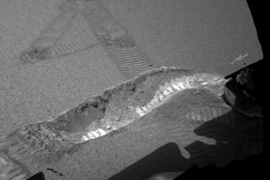 This is a 3-D model of the trench excavated by NASA's Mars Exploration Rover Opportunity on the 23rd day, or sol, of its mission. An oblique view of the trench from a bit above and to the right of the rover's right wheel is shown.