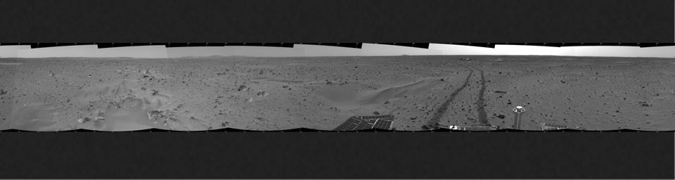This 360-degree mosaic panorama image, taken by the navigation camera onboard NASA's Mars Exploration Rover Spirit, includes a view of the lander. The lander is to the south-southwest of the rover, which is moving toward a crater nicknamed 'Bonneville.'